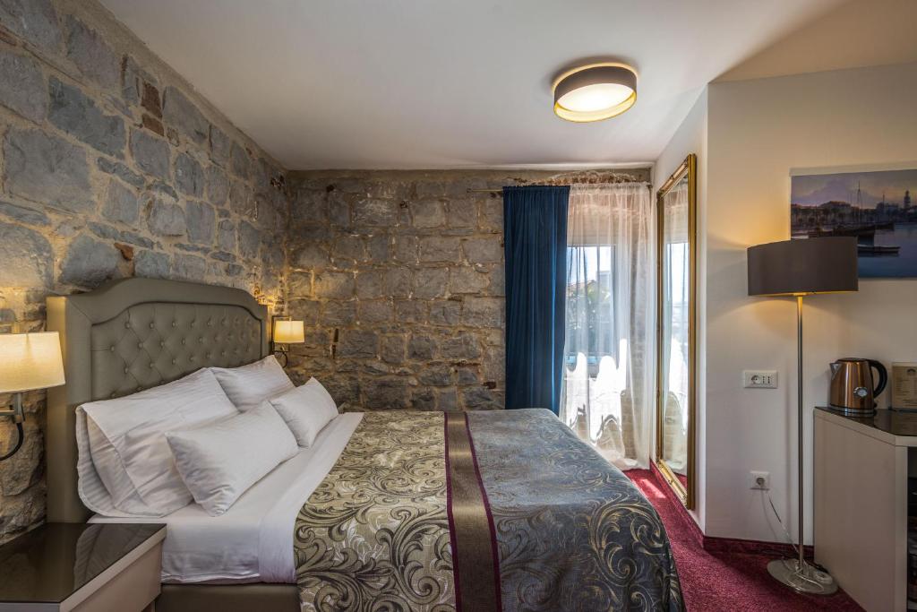 Postel nebo postele na pokoji v ubytování Hotel Agava Split