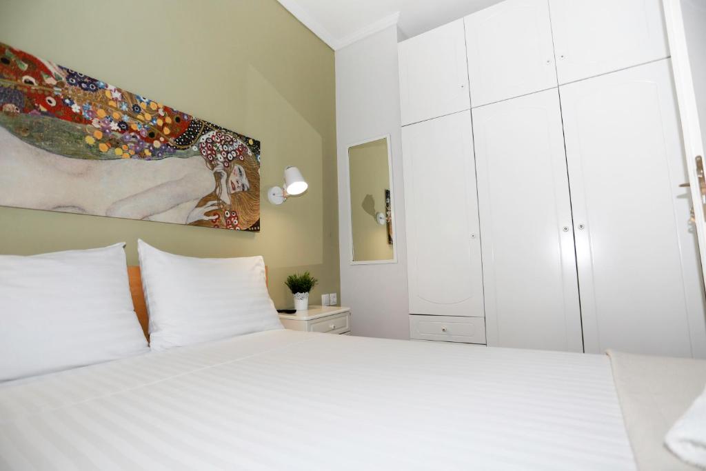 Postel nebo postele na pokoji v ubytování Bianca Suites