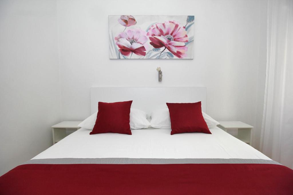 Postel nebo postele na pokoji v ubytování Apartments Miovic