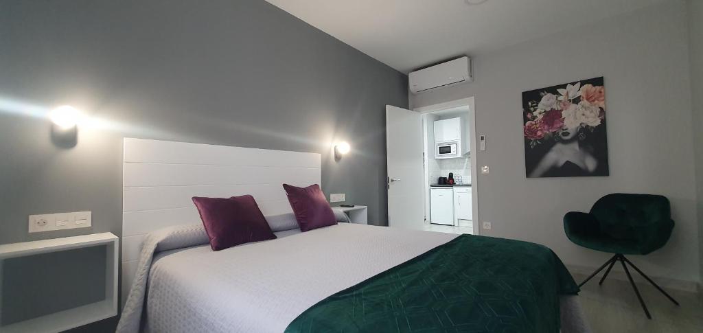 Posteľ alebo postele v izbe v ubytovaní Apartamentos Harmonia