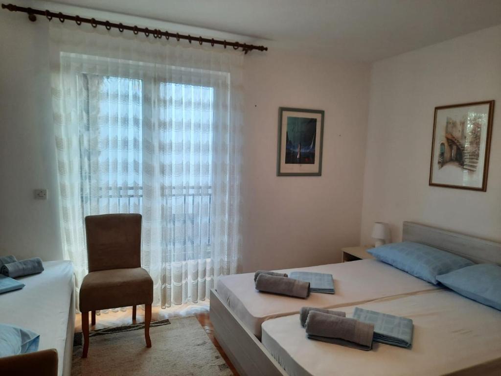 Łóżko lub łóżka w pokoju w obiekcie Holiday Home Marija