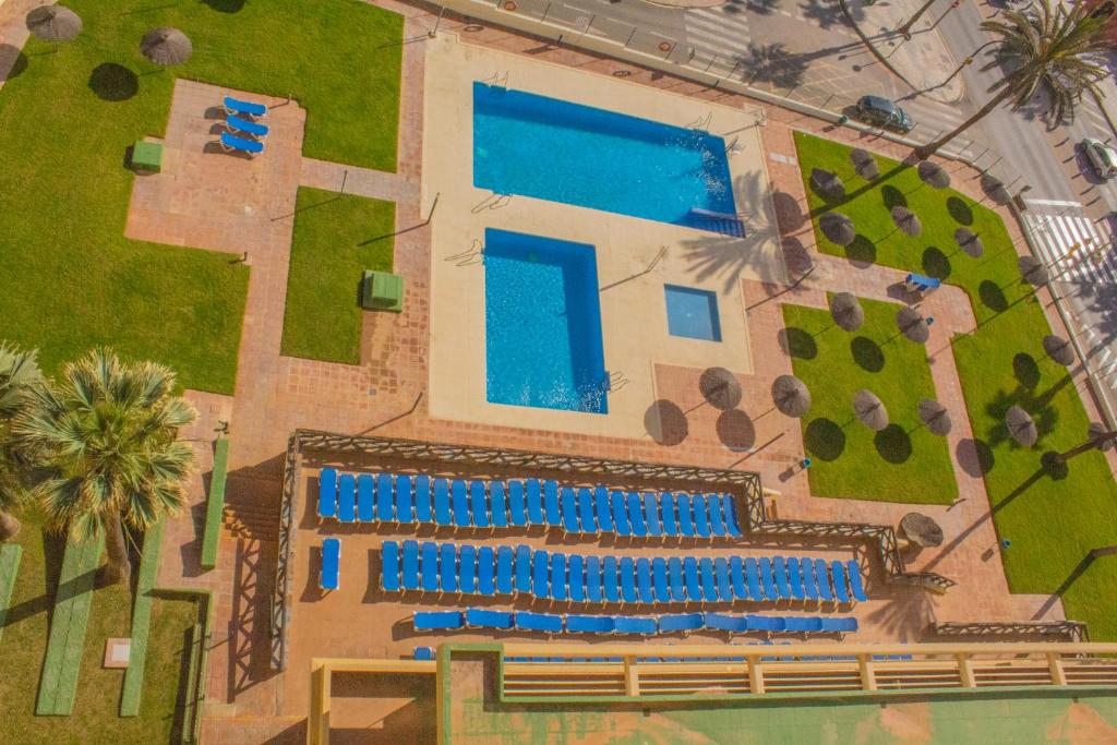 Bazén v ubytovaní Aloha Playa Apartment with panoramic sea view and pools alebo v jeho blízkosti