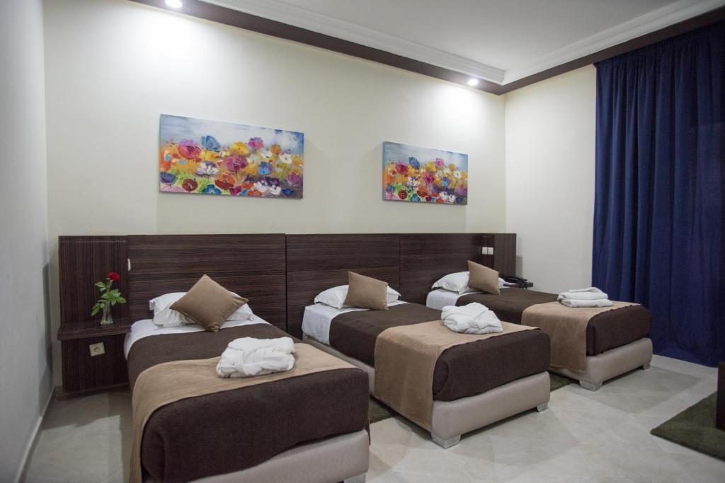 Postel nebo postele na pokoji v ubytování Hôtel Rif