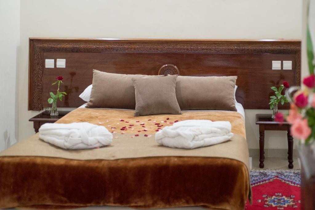 Postel nebo postele na pokoji v ubytování Hôtel Rif