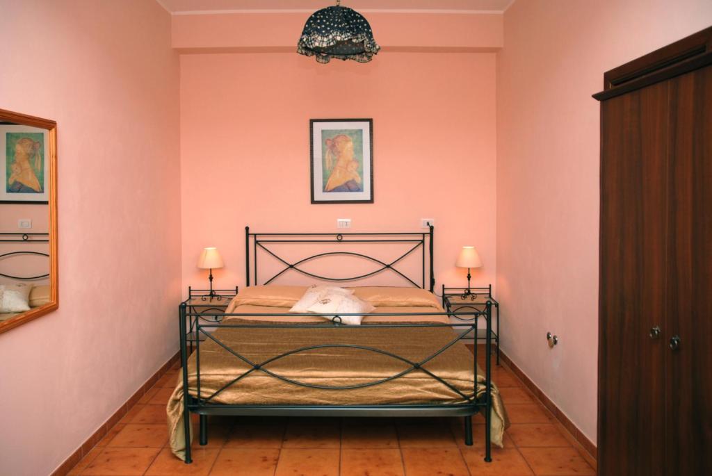 Postel nebo postele na pokoji v ubytování B&B Ulisse