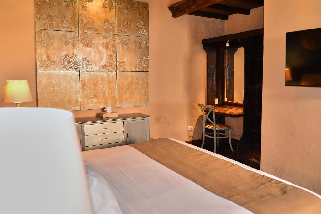 Postel nebo postele na pokoji v ubytování Hotel Mesones 49