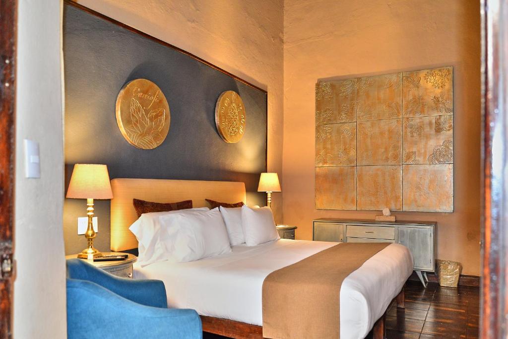 Postel nebo postele na pokoji v ubytování Hotel Mesones 49