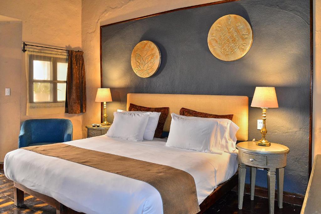 Postel nebo postele na pokoji v ubytování Hotel Mesones 49
