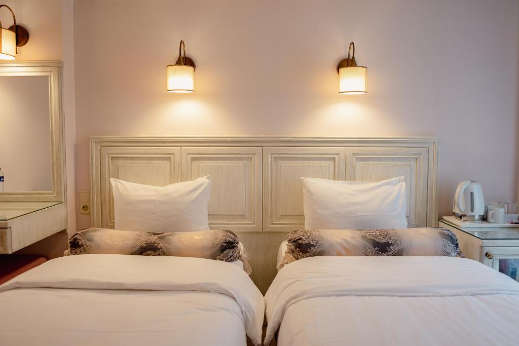 Postel nebo postele na pokoji v ubytování Agora Guesthouse