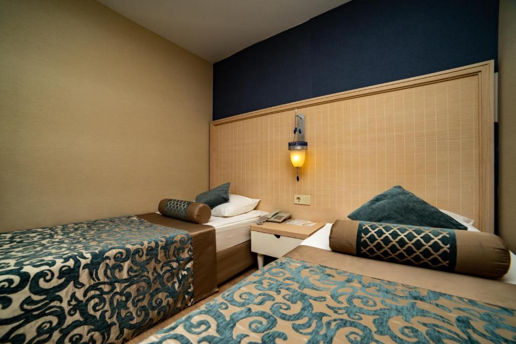 Postel nebo postele na pokoji v ubytování Seamelia Beach Resort Hotel & SPA