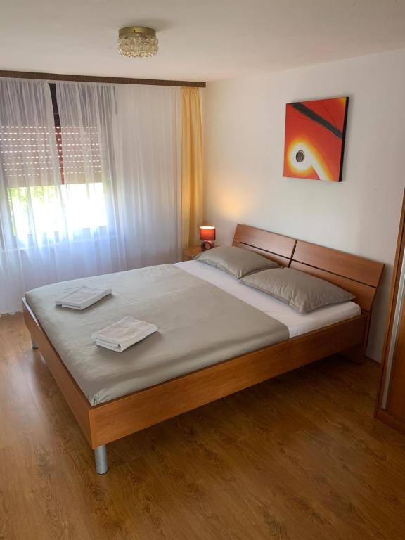 Łóżko lub łóżka w pokoju w obiekcie Apartments Vitez