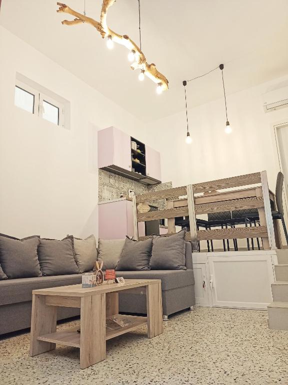 a living room with a couch and a table at Marw's home in Nafplio