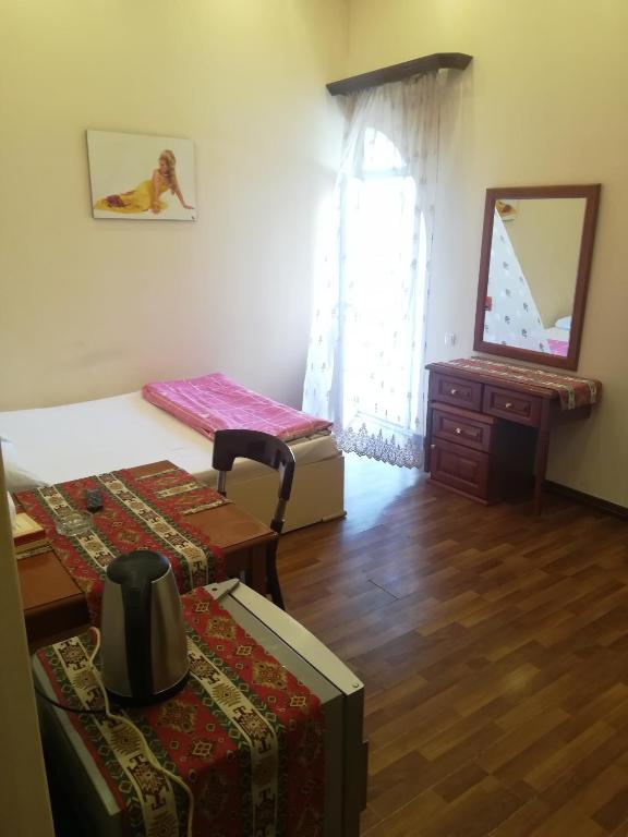 Postel nebo postele na pokoji v ubytování NEW BELLA HOTEL