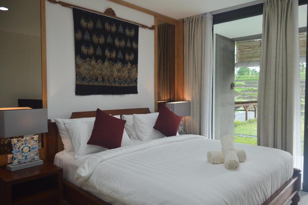 Postel nebo postele na pokoji v ubytování Serenity Private Villa Mas Ubud