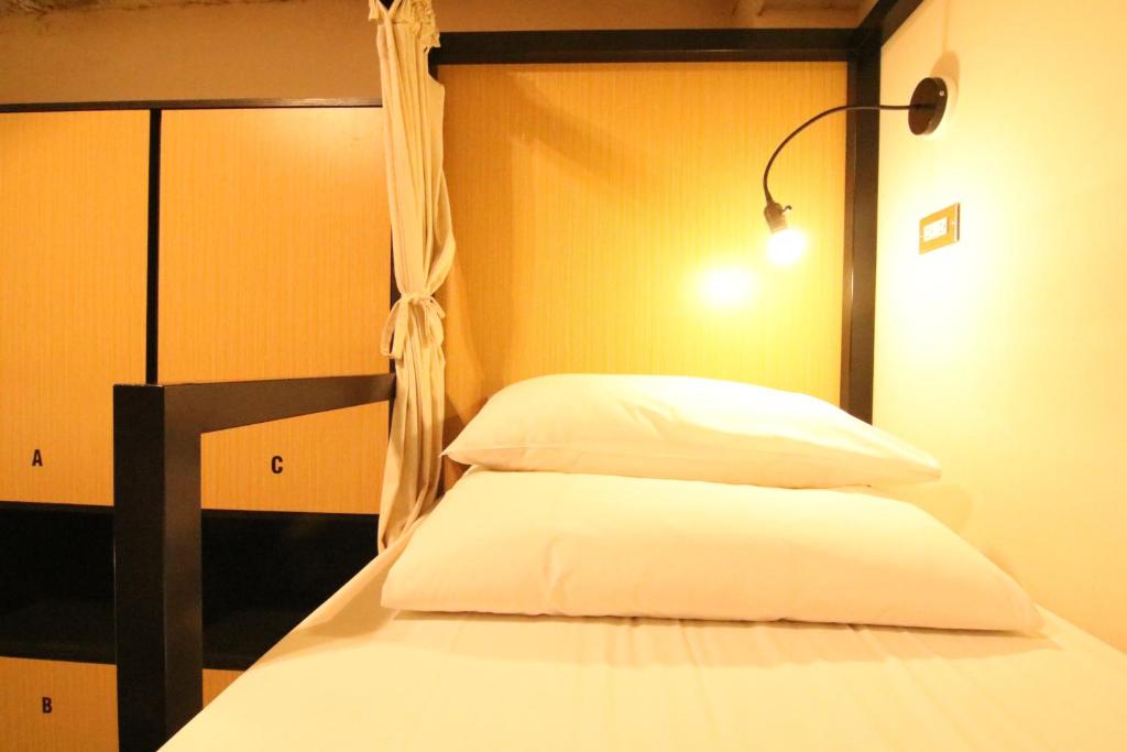 Postel nebo postele na pokoji v ubytování DONGMEN 3 Hostel