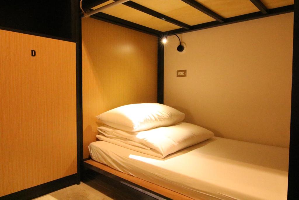 Postel nebo postele na pokoji v ubytování DONGMEN 3 Hostel