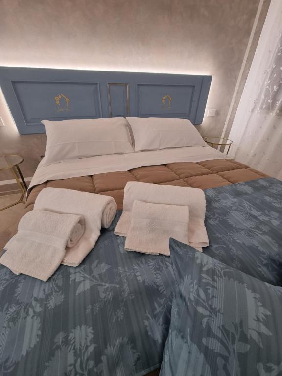 Letto o letti in una camera di CENTO FIORI