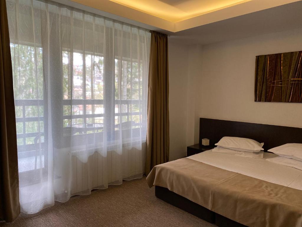 Postel nebo postele na pokoji v ubytování Hotel Smart