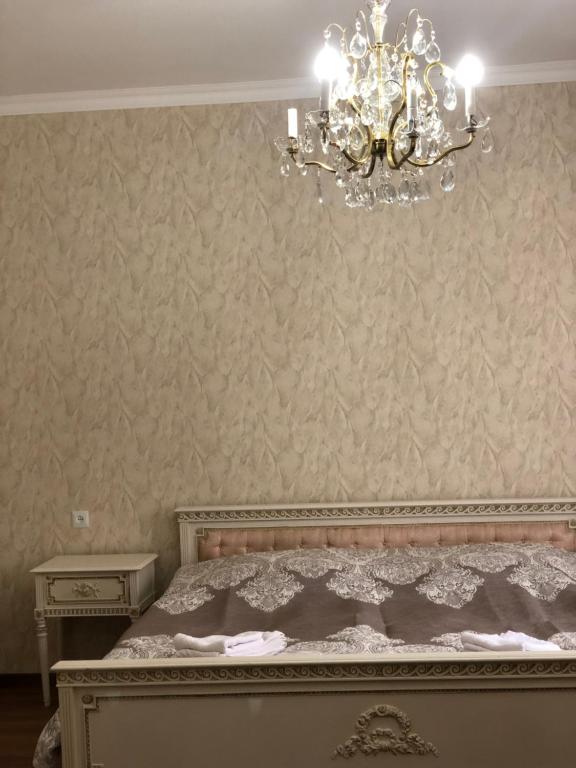 Postel nebo postele na pokoji v ubytování Lia Khaikashvili Guest House
