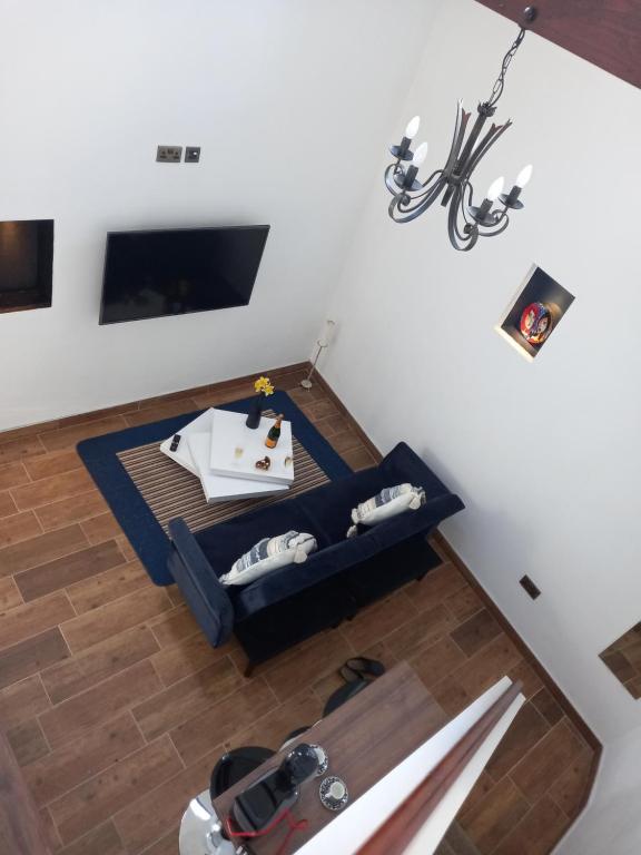 an overhead view of a living room with a blue couch at Derrywilligan Guest Accommodation in Bessbrook