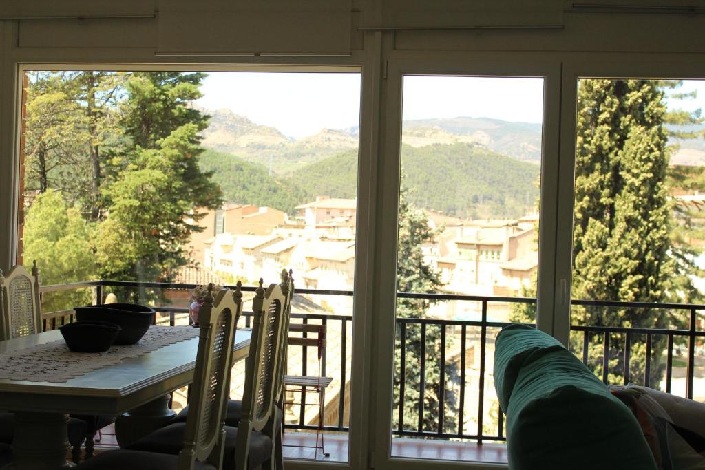 a view of a balcony with a table and chairs at marsupilami in La Pobla de Segur
