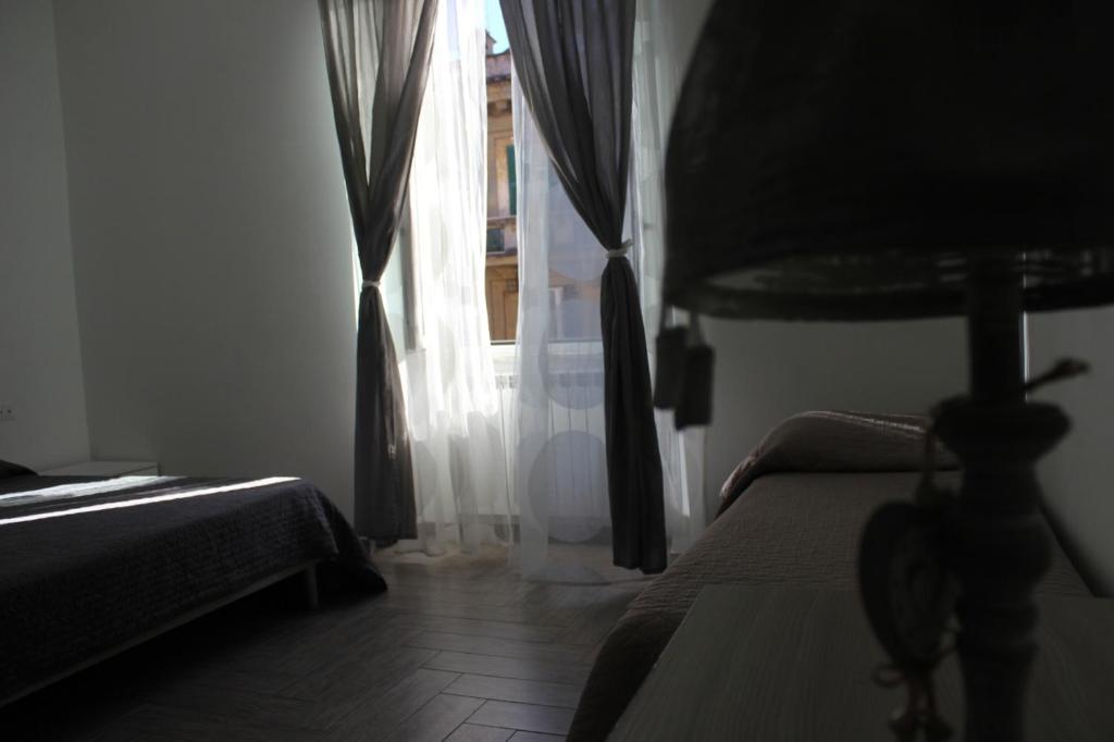 A bed or beds in a room at La residenza del Principe