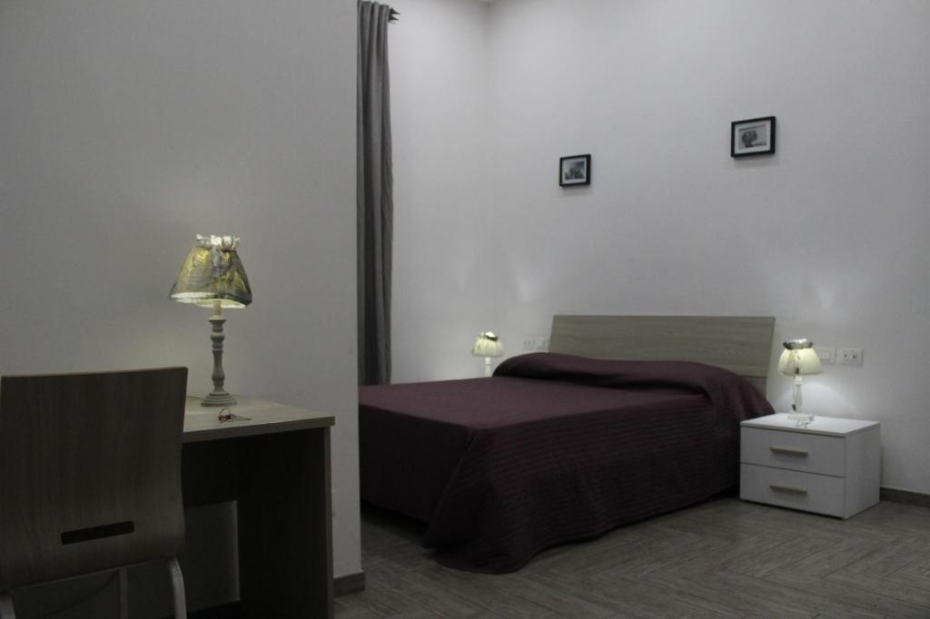 A bed or beds in a room at La residenza del Principe