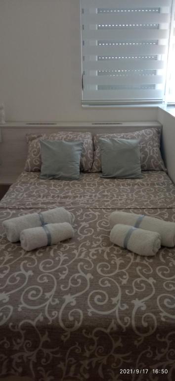 Postel nebo postele na pokoji v ubytování Emili Apartman