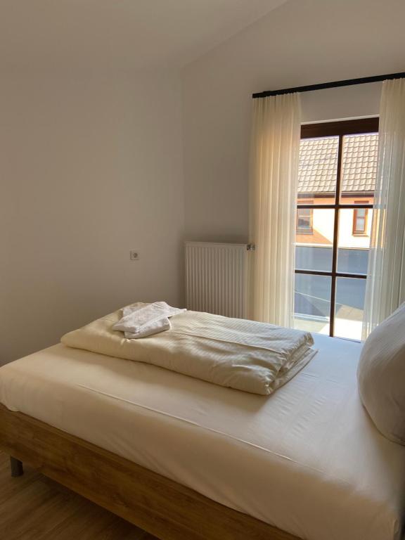 Postel nebo postele na pokoji v ubytování Der Limes Kipfenberg