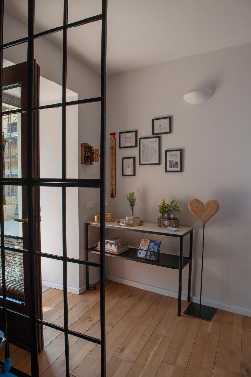 a room with a book shelf and a table at Sun Garda in Ponti Sul Mincio