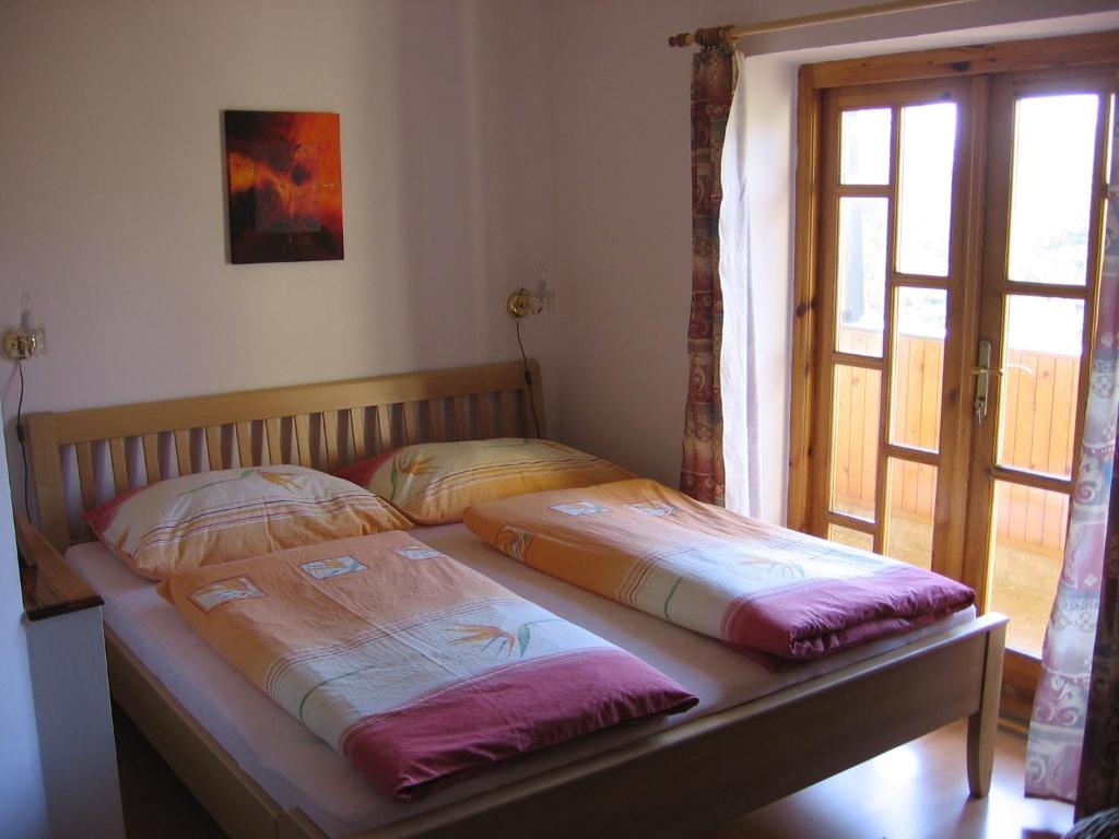 Postel nebo postele na pokoji v ubytování Pension Trojská