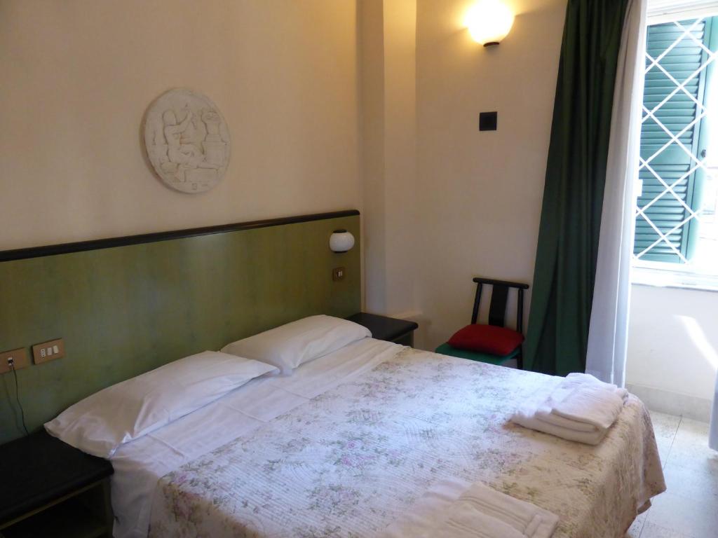 Postel nebo postele na pokoji v ubytování Hotel Prati