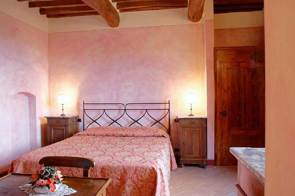 Postel nebo postele na pokoji v ubytování La Locanda di Quercecchio
