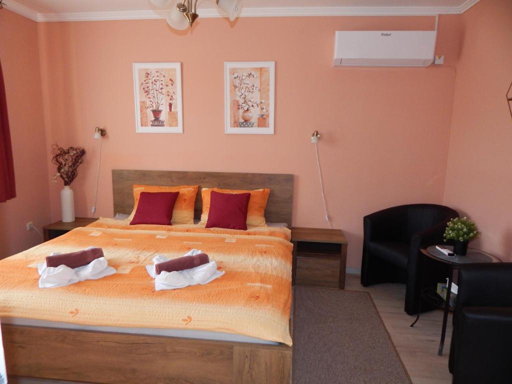 Posteľ alebo postele v izbe v ubytovaní Völgy Apartman