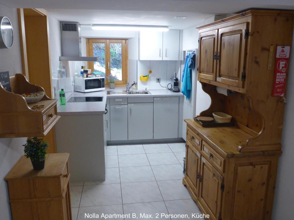 Kuchyň nebo kuchyňský kout v ubytování Nolla Apartment
