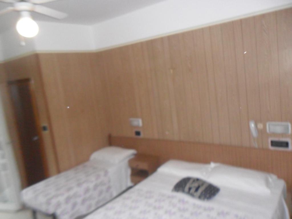 Postel nebo postele na pokoji v ubytování Hotel Giordano Spiaggia