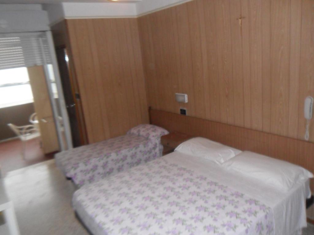 Postel nebo postele na pokoji v ubytování Hotel Giordano Spiaggia