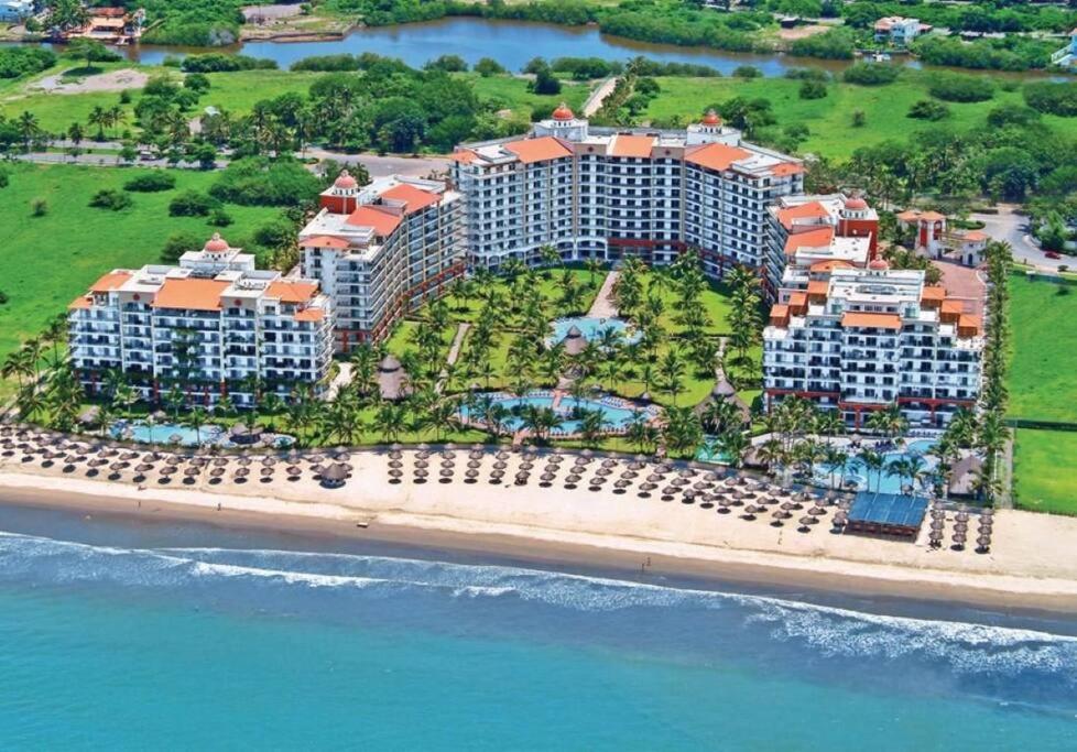 an aerial view of a resort on the beach at Beachfront 2 bedroom Condo in Playa Royale Resort, Nuevo Vallarta in Nuevo Vallarta 