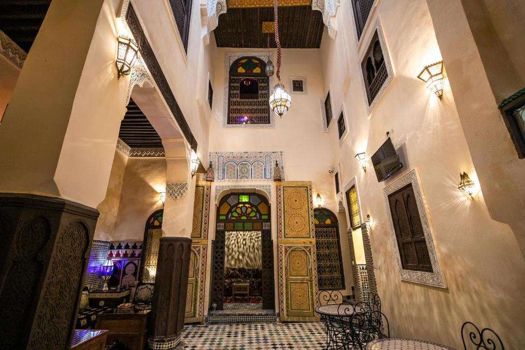 a hallway of a building with a large door at Dar Panoramic Fez in Fès