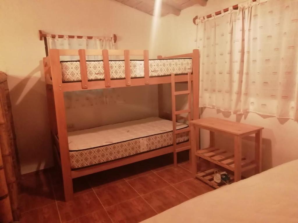 En eller flere senge i et værelse på Bungalows Luna y Mar