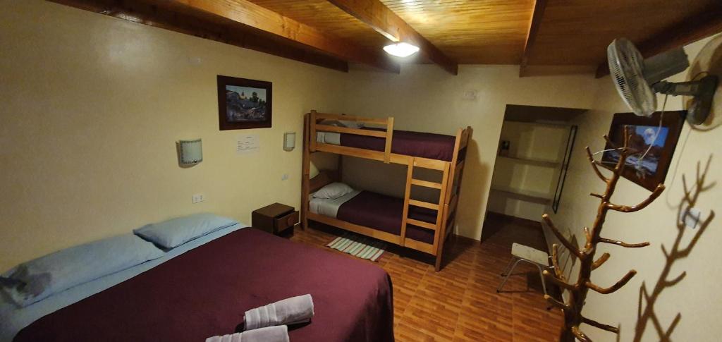Postel nebo postele na pokoji v ubytování Hostal Ckamai