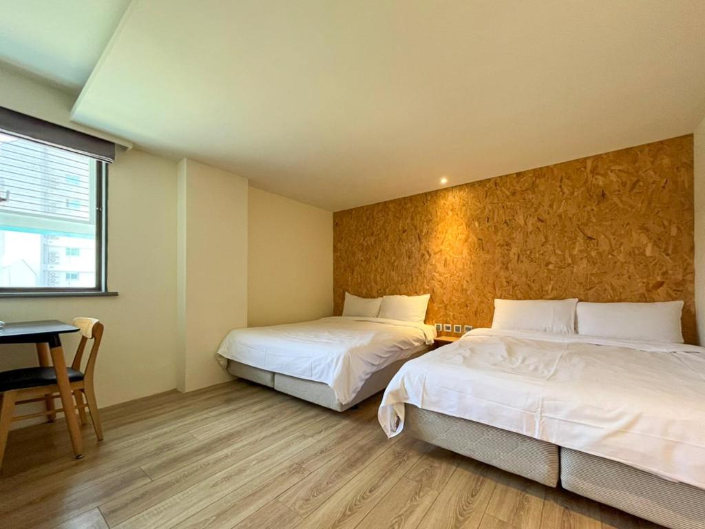 Postel nebo postele na pokoji v ubytování Light Hostel - Tainan