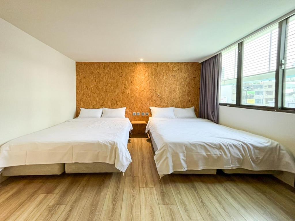 Postel nebo postele na pokoji v ubytování Light Hostel - Tainan