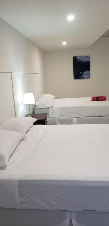 Postel nebo postele na pokoji v ubytování Hotel El Dorado