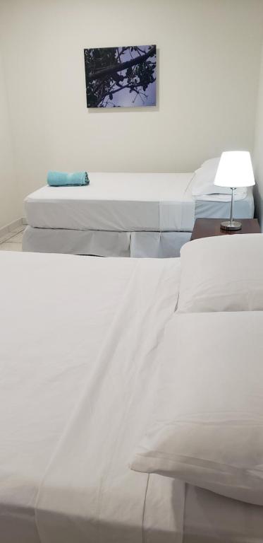 Postel nebo postele na pokoji v ubytování Hotel El Dorado