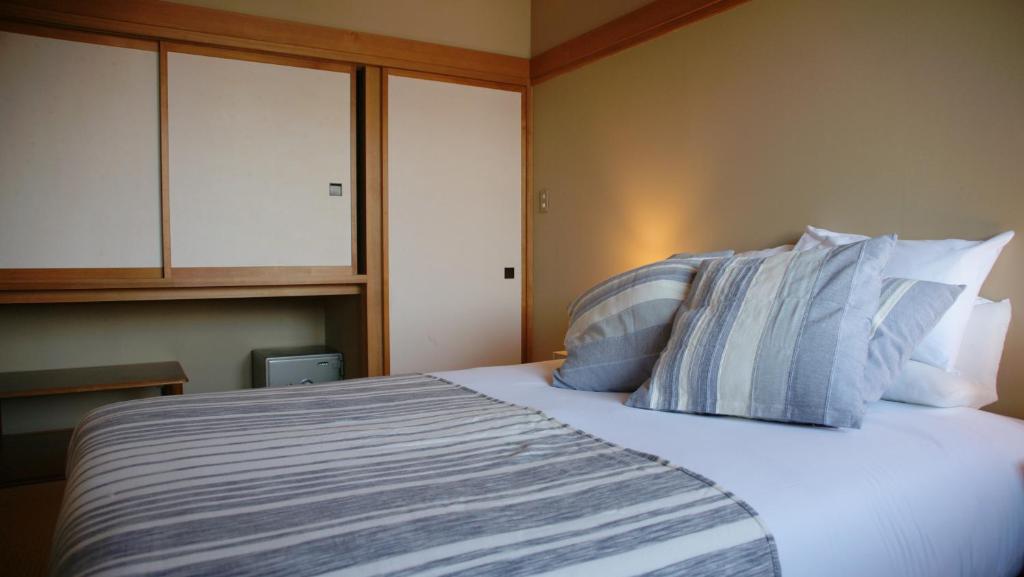 Postel nebo postele na pokoji v ubytování Red Fox Lodge Myoko