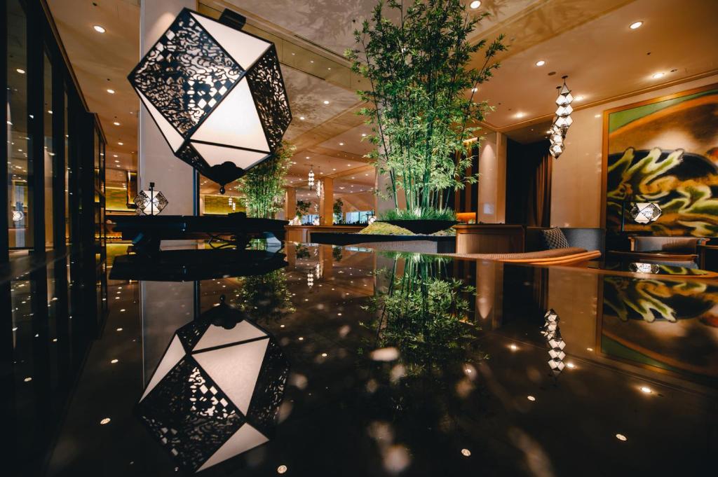 a lobby with black and white lights and a table at Grand Prince Hotel Shin Takanawa in Tokyo