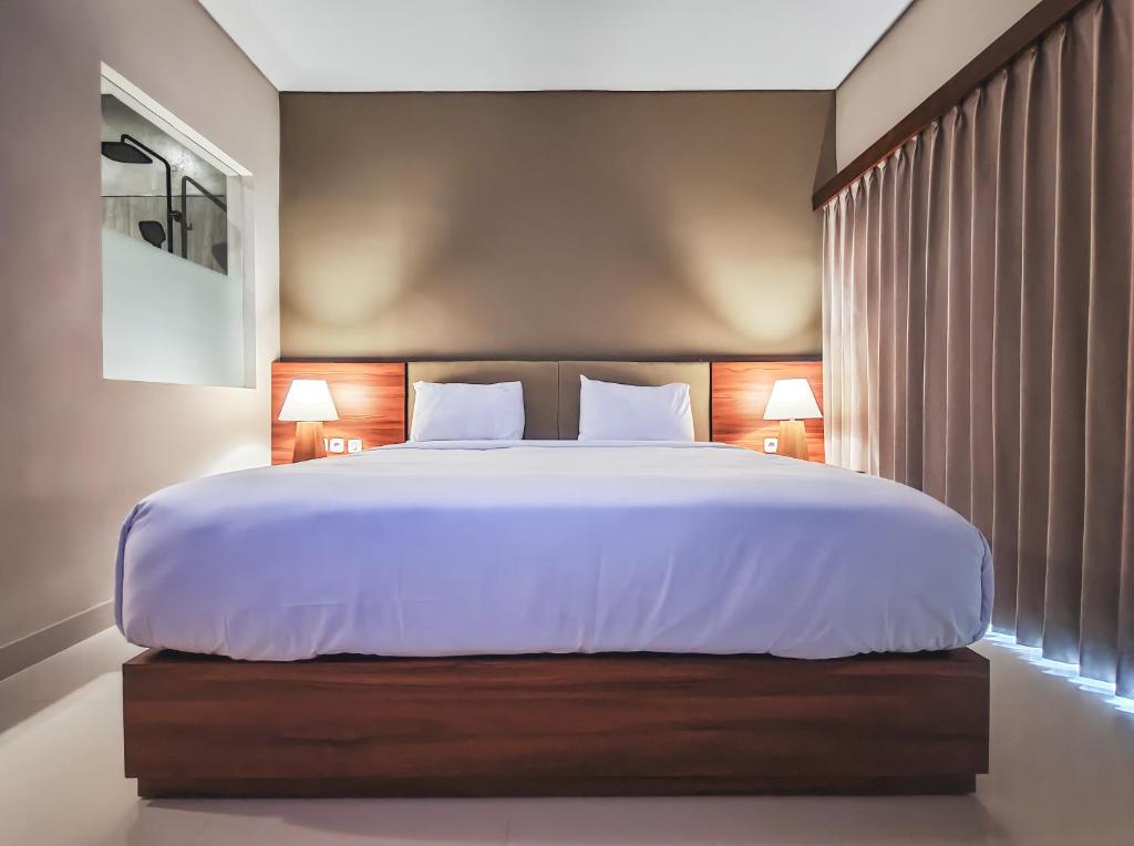 Postel nebo postele na pokoji v ubytování Grand Sehati & Spa, Ubud