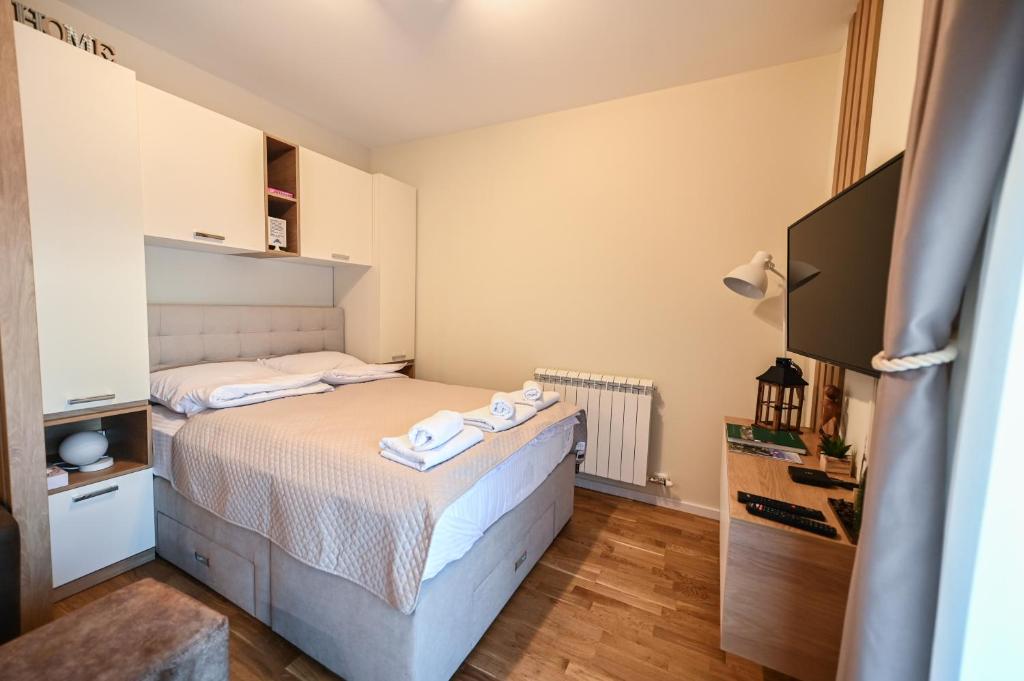 Postel nebo postele na pokoji v ubytování MB APARTMAN TARA