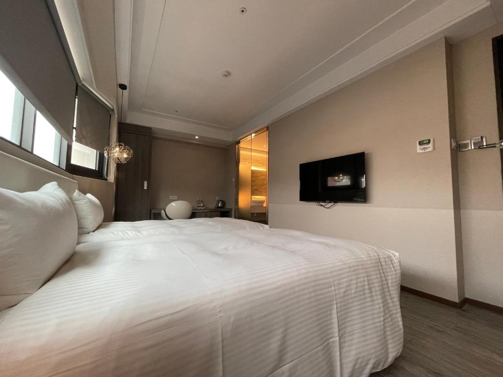 Postel nebo postele na pokoji v ubytování Royal Fine Hotel